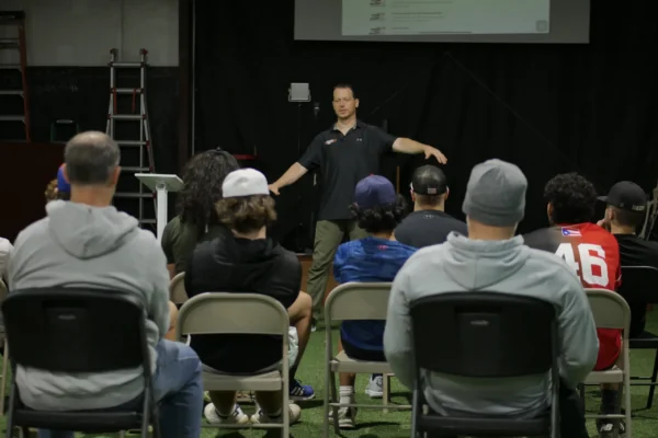 Brent Pourciau teaching a seated group during a TopVelocity education session.