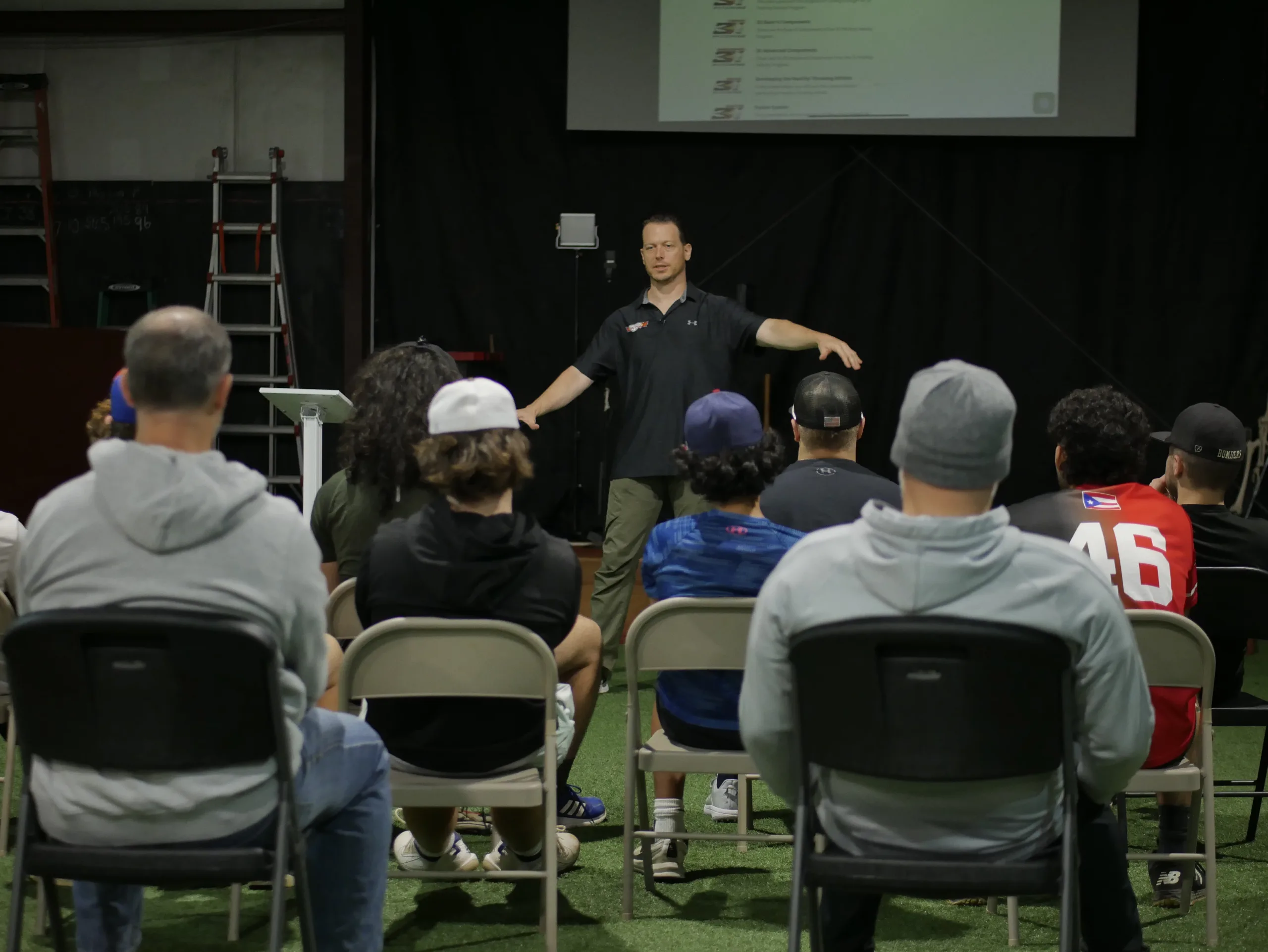 Brent Pourciau teaching a seated group during a TopVelocity education session.